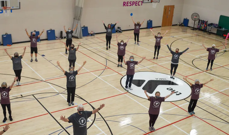 Fitness class participants in a gymnasium