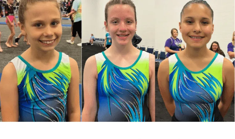 Three gymnasts from the Strivers gymnastics team pose with their medals