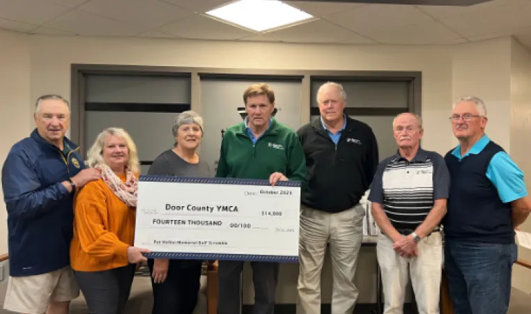 Photo from left to right: organizer Carl Podlasek, Door County YMCA - Kane Center Executive Holly Butenhoff, spouse of the late Pat Hellen Deb Hellen, Maxwelton Braes Golf Course owner Mark Murphy, organizer Jim Bresnahan, organizer Jim Musiel, organizer Marc Harding