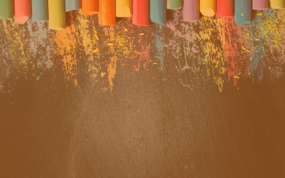 A row of chalk above a blackboard