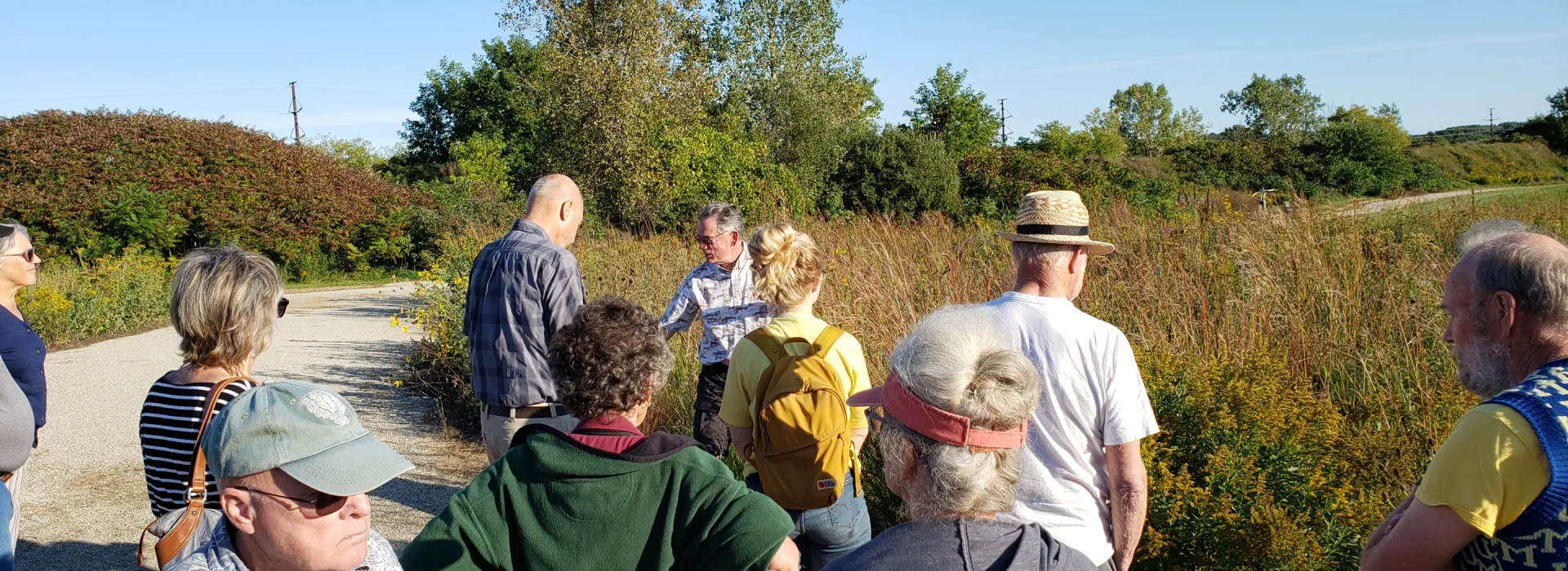Mark Holey and Sue Kunz lead a walking tour of the prairie garden.