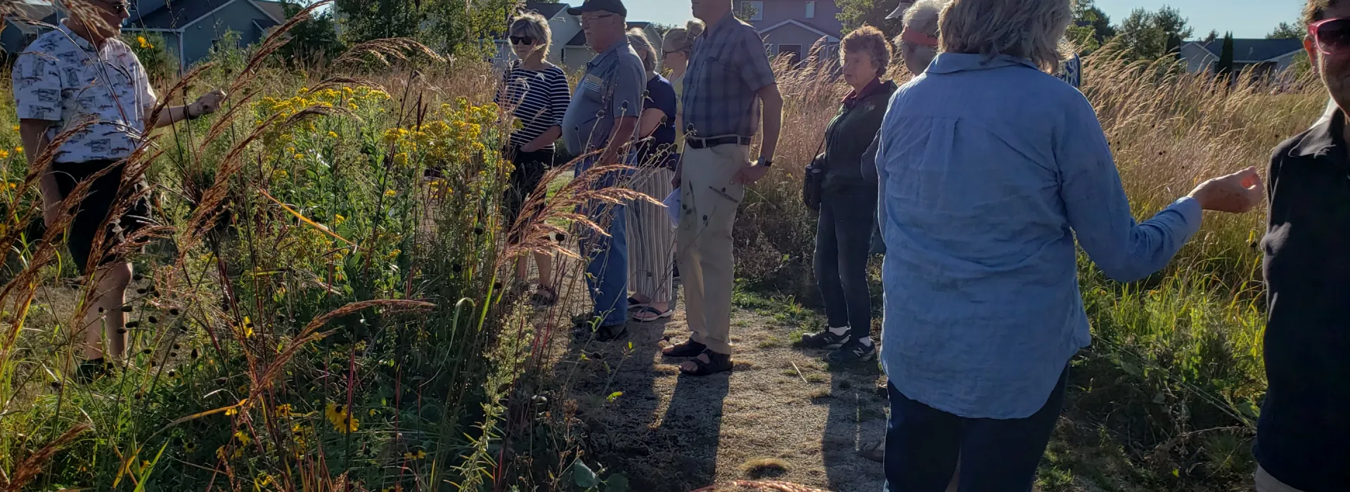 Mark Holey and Sue Kunz lead a walking tour of the prairie garden.